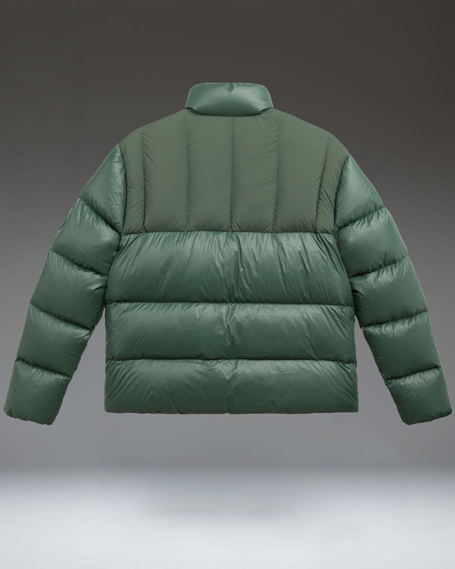 A lightweight, green Pineneedle puffer jacket from Herschel Supply Co. with a water-repellent nylon shell and down insulation.