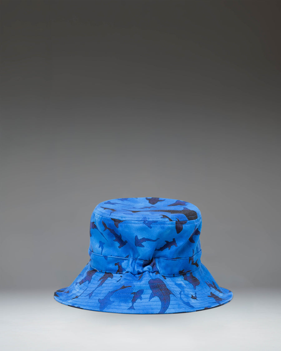 Herschel Supply Co. Toddler Bucket Hat (2-4 Years) in Sharks pattern featuring a blue background with various shark illustrations.