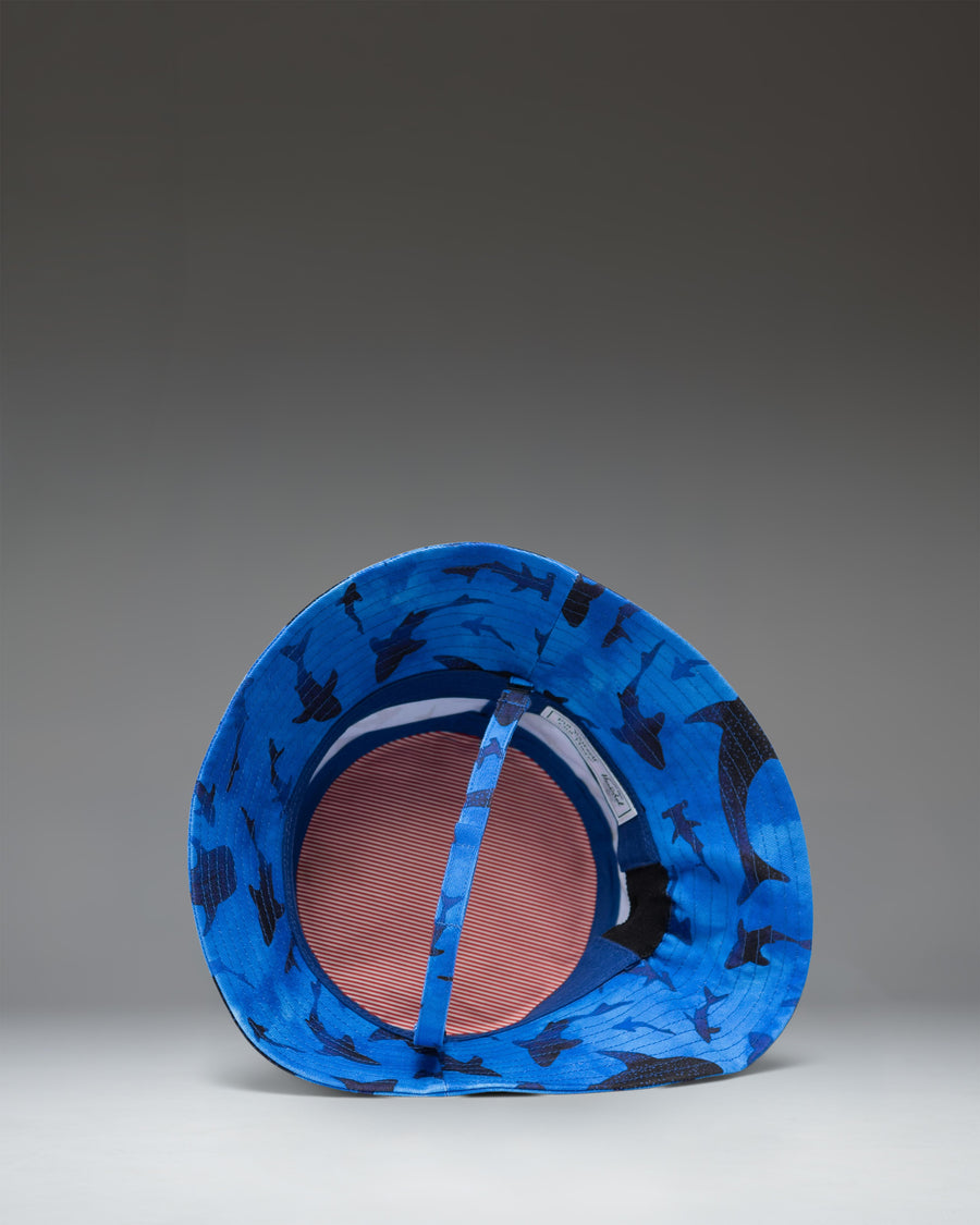Toddler Bucket Hat 2-4 Years in Sharks colorway, featuring a blue background with a pattern of cartoon sharks.