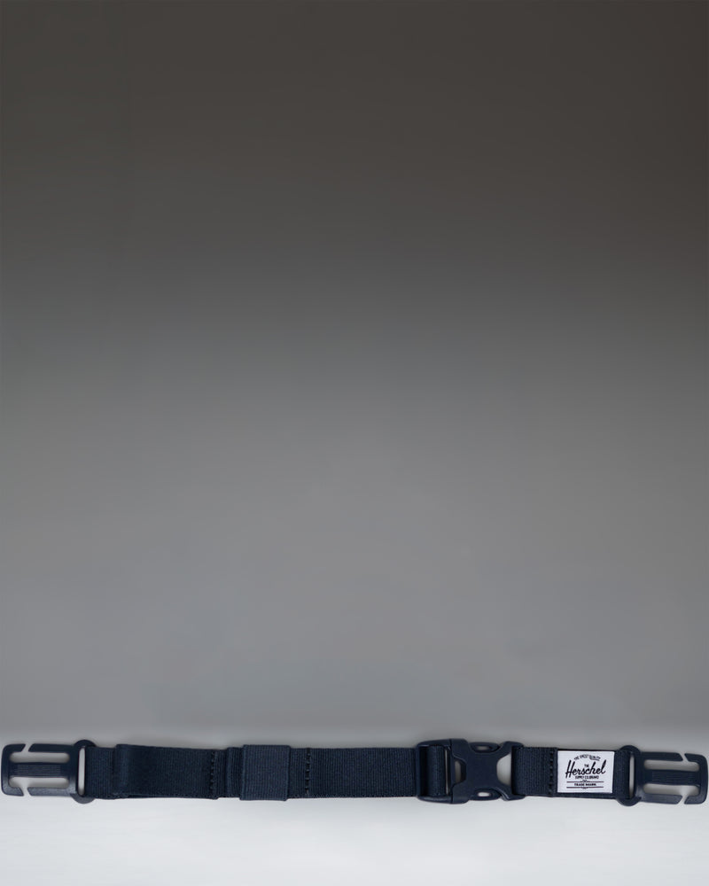 Herschel Supply Co. Sternum Strap in navy blue, designed to attach to backpack shoulder straps for added support and comfort.