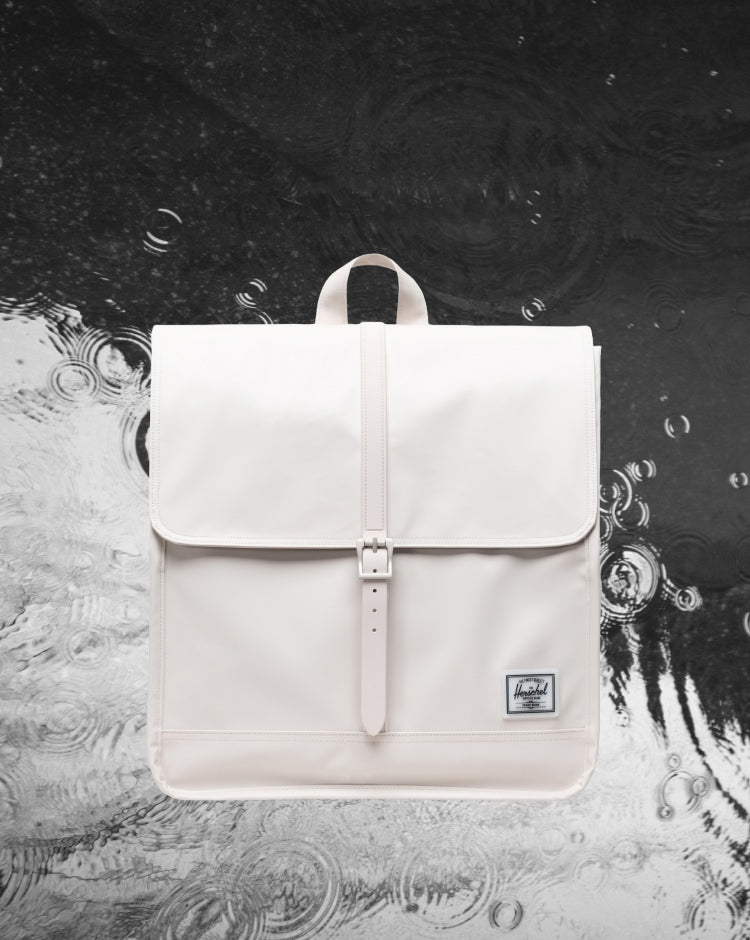 Herschel Supply Co. City Backpack in Moonbeam Tonal, a light grey minimalist backpack shown from the front.