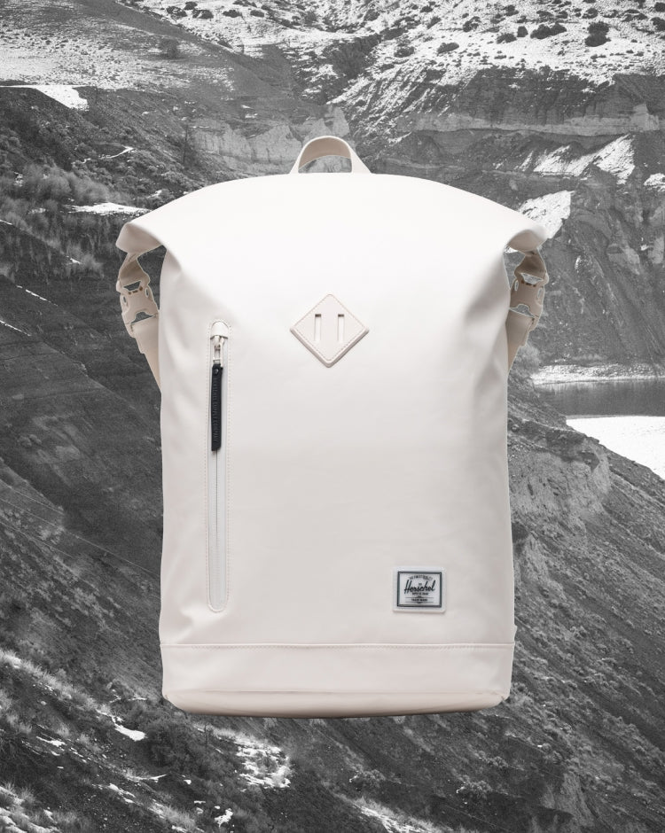 Herschel Supply Co. Roll Top Backpack in Moonbeam Tonal, displaying a clean, modern design with a roll-top closure and adjustable straps.