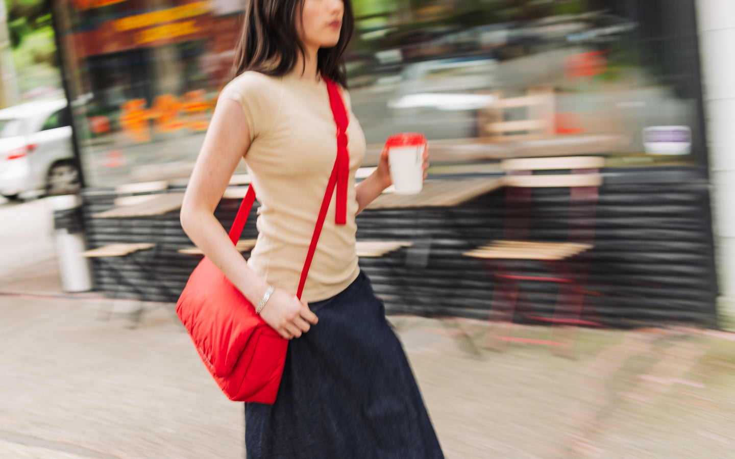 Herschel Supply Co. Cloudform Crossbody bag in Salsa, featuring a puffy, minimalist design with an adjustable strap.