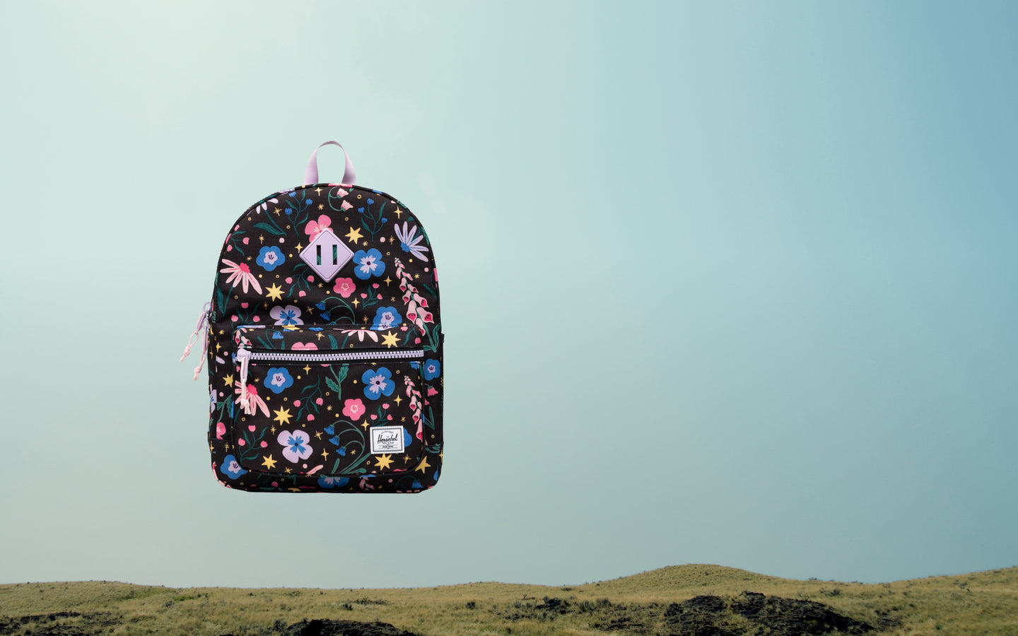 Herschel Heritage Kids Backpack in Enchanted Garden floral print.