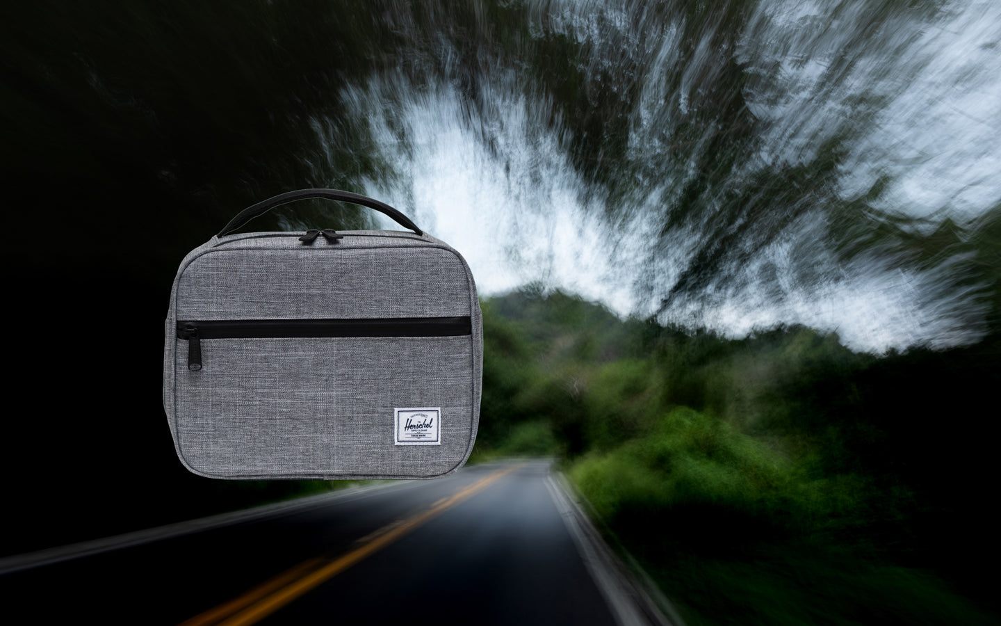 Herschel Supply Co. Pop Quiz Lunch Box in Raven Crosshatch, featuring an insulated main compartment and a front pocket with a waterproof zipper.