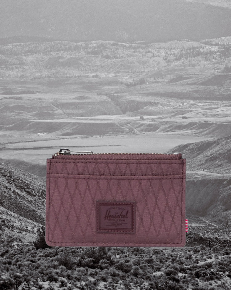 Herschel Supply Co. Oscar Cardholder wallet in Huckleberry Diamond, a dark teal hue with a quilted diamond pattern.