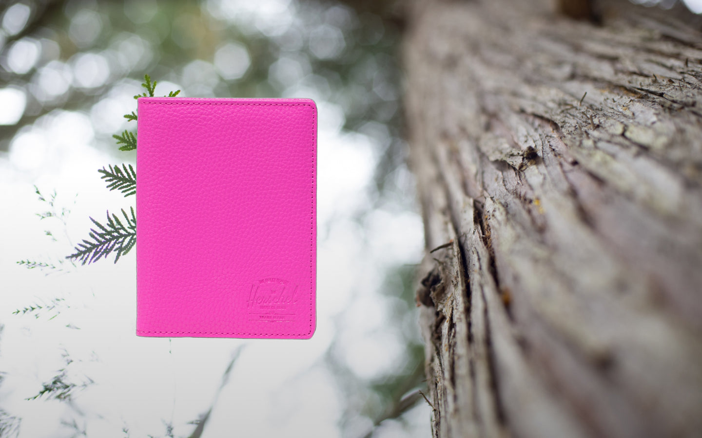 Herschel Supply Co. Raynor Passport Holder in vegan leather, showcasing a vibrant Rose Violet colorway.