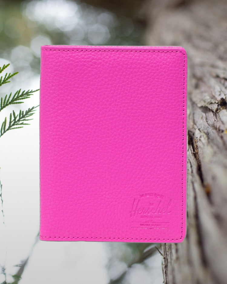 Herschel Supply Co. Raynor Passport Holder in Rose Violet vegan leather, shown from the front.