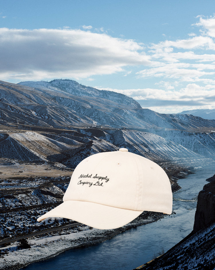 Herschel Supply Co. Sylas Vintage Cotton Cap in Vintage White, shown from the front.