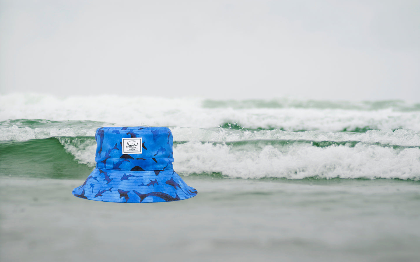 Herschel Supply Co. Toddler Bucket Hat (2-4 Years) in Sharks pattern featuring a playful shark print against a solid background.