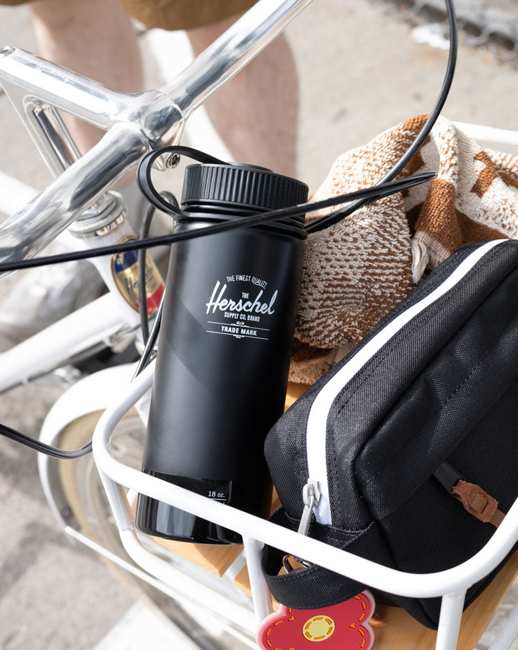 Herschel Supply Co. insulated 18oz (530ml) water bottle in a sleek black finish with a glossy sheen.