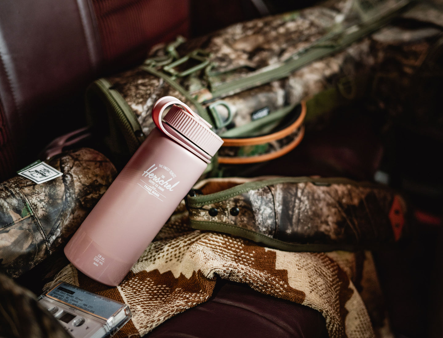 Herschel Supply Co. 18oz insulated water bottle in Ash Rose with a gloss finish, shown from a front angle against a clean background.