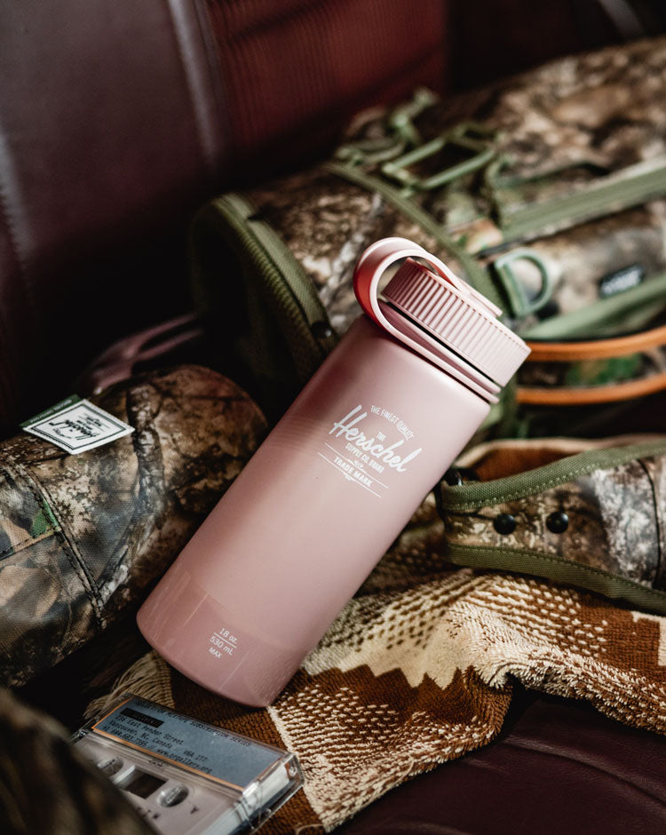 Herschel Supply Co. 18oz insulated water bottle in Ash Rose with a gloss finish.