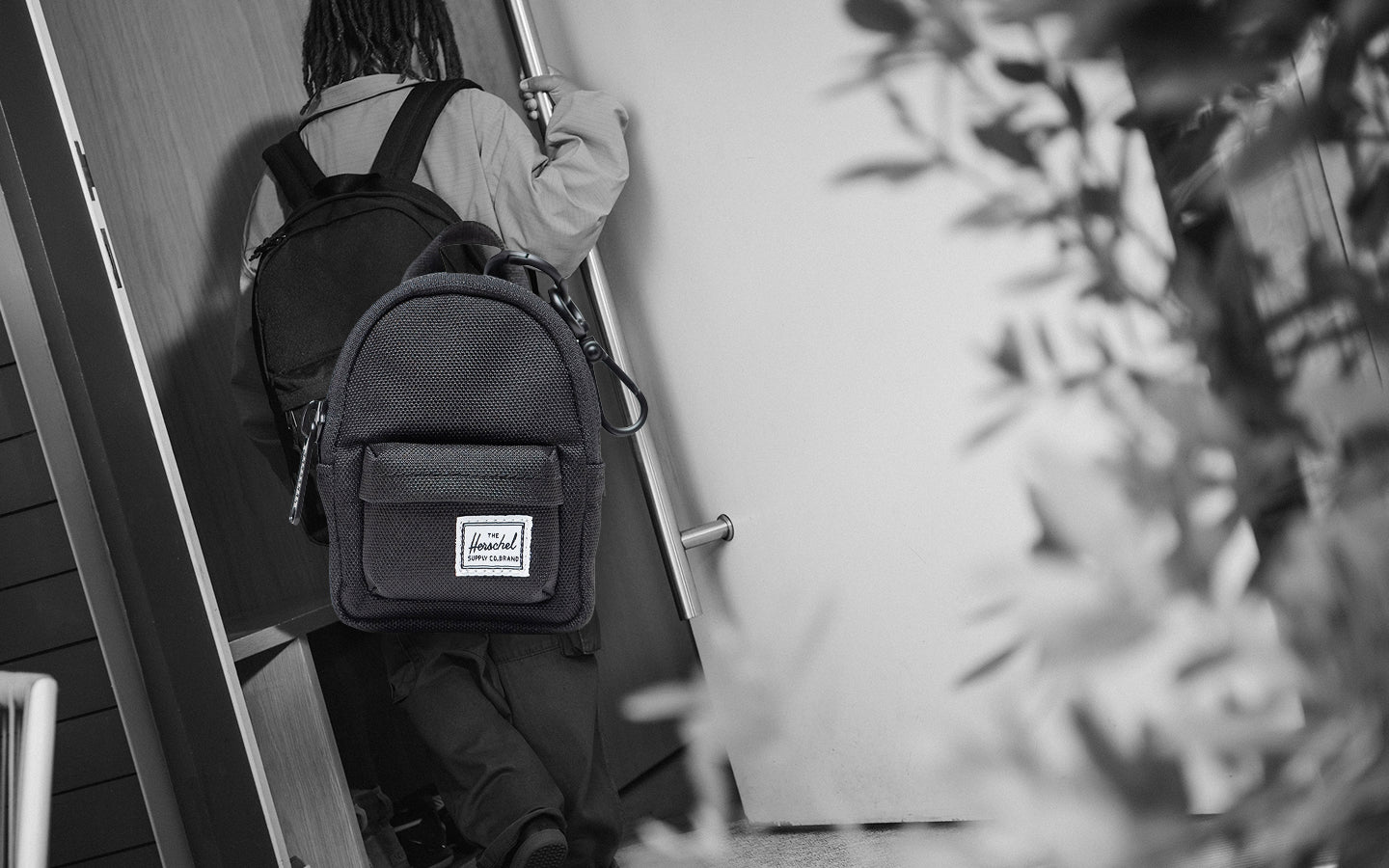 Herschel Supply Co. Classic Backpack Bag Charm in black, a miniature backpack accessory.