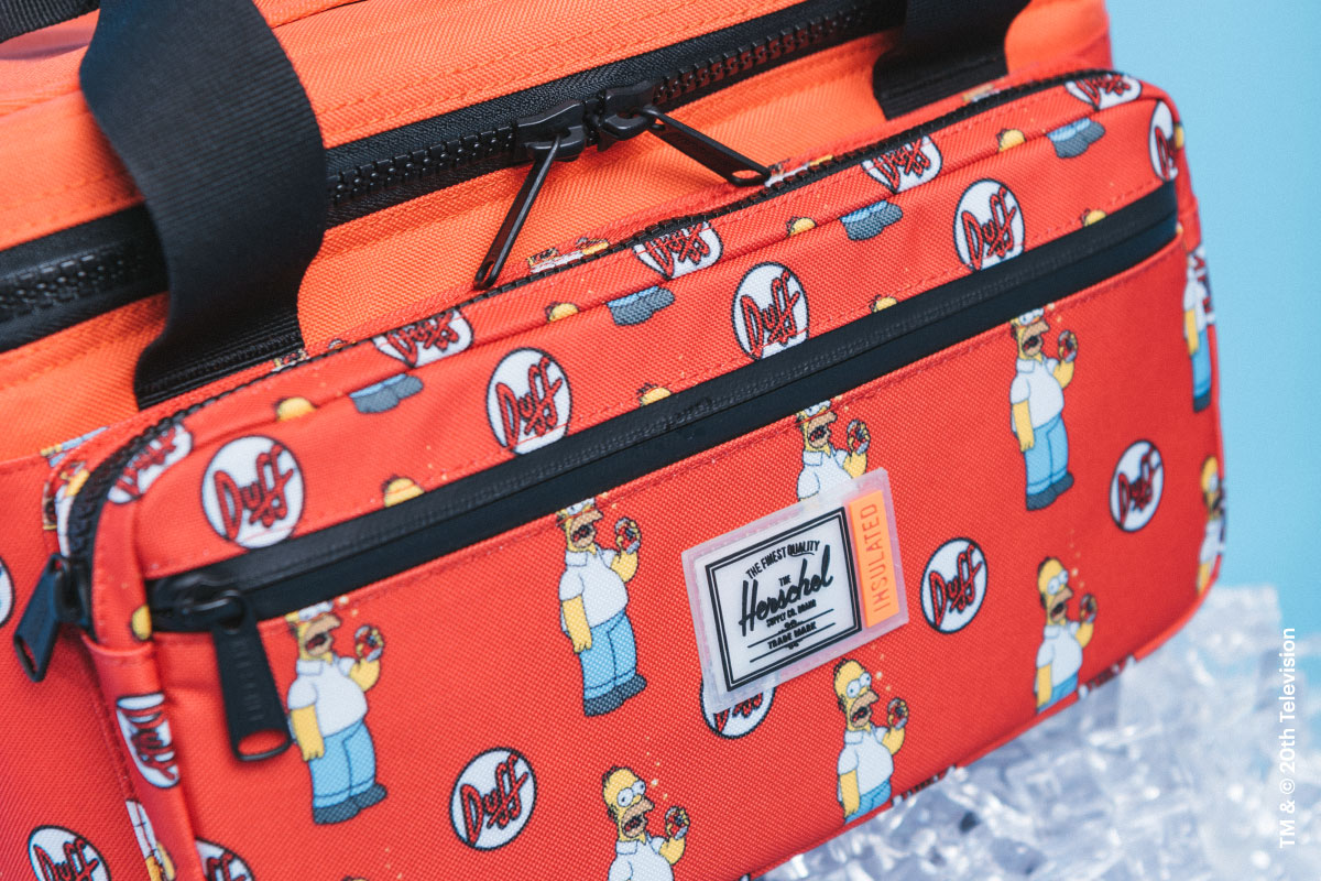 A shot of the Duff Beer Pop Quiz Cooler 12 Pack Insulated Simpsons from The Simpsons™ x Herschel Supply Company collection